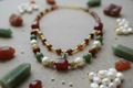 Necklace with various beads on a textured surface