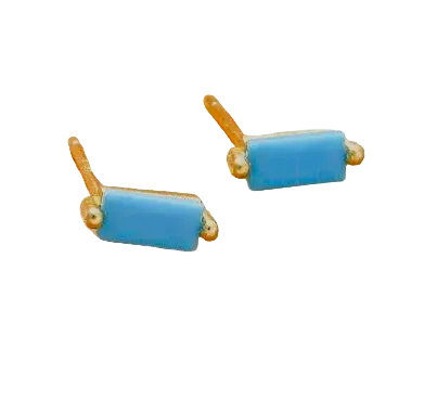 Pair of turquoise bar earrings on a textured brown surface
