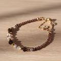 Necklace with multicolored beads on a wooden surface